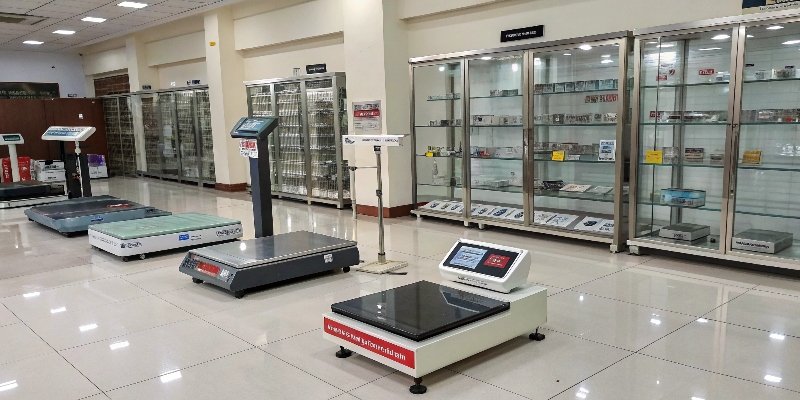 A diverse range of industrial weighbridges and weighing scales in a showroom