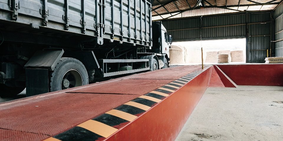 Importance of industrial weighing An industrial truck being weighed on a truck scale