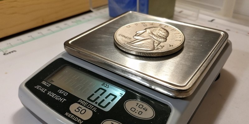 Calibrating a scale with a nickel A U.S. nickel on a digital scale for calibration
