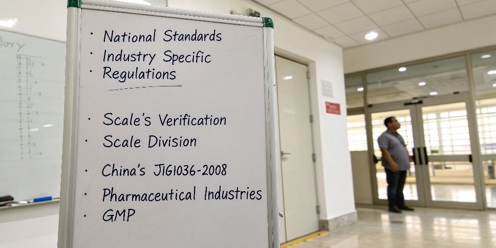 Key factors for setting engineering tolerances on a whiteboard List of tolerance factors on a whiteboard