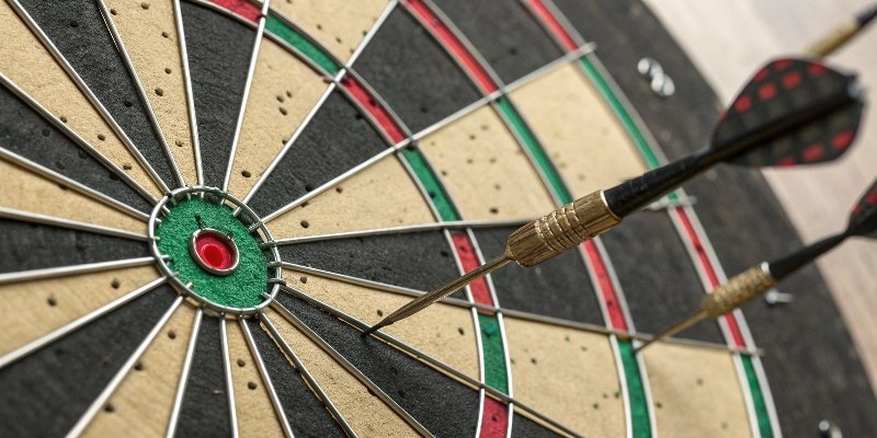 A four-panel image showing the dartboard analogy: 1. Accurate & Precise (tight group on bullseye), 2. Precise but not Accurate (tight group off-center), 3. Accurate but not Precise (shots scattered around the bullseye), 4. Not Accurate & Not Precise (shots scattered everywhere).