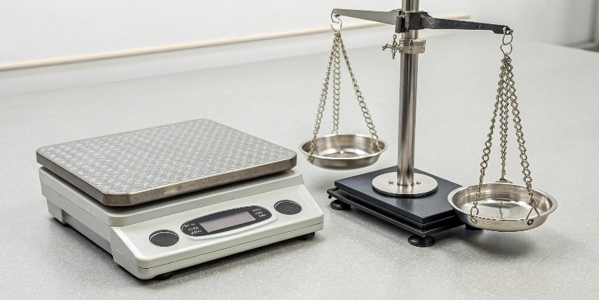 Functional Difference: Balance vs. Scale A laboratory balance and an industrial platform scale side-by-side