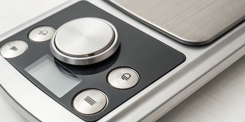 Multi-function scale button A close-up of a single multi-function button on a digital scale labeled On/Off/Tare/Zero