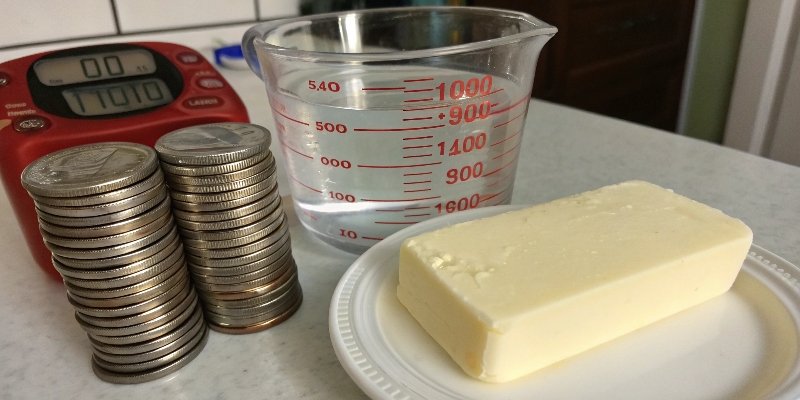 DIY 100g Calibration Weights A stack of 20 nickels, 100ml of water, and other items that can be used as a 100g weight