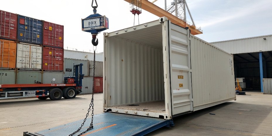 Measuring the tare weight of an empty container An empty shipping container being weighed to determine its tare weight before loading