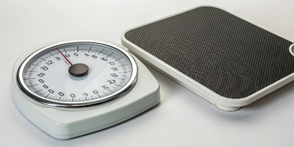 Analog vs. Digital Scales An analog scale and a digital scale side-by-side