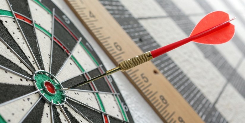 Accuracy Bullseye versus Resolution Ruler A split image showing a bullseye with all darts in the center (accuracy) and a ruler with very fine markings (resolution).
