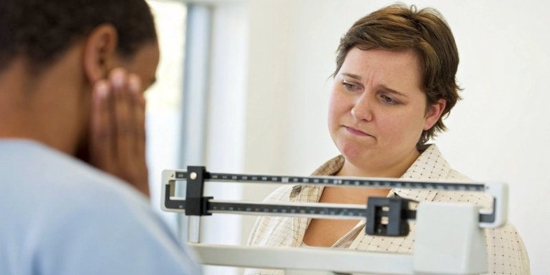 A person looking at a scale with a puzzled expression, with a question mark graphic overhead.