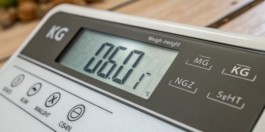 A close-up of a digital scale display showing kilograms