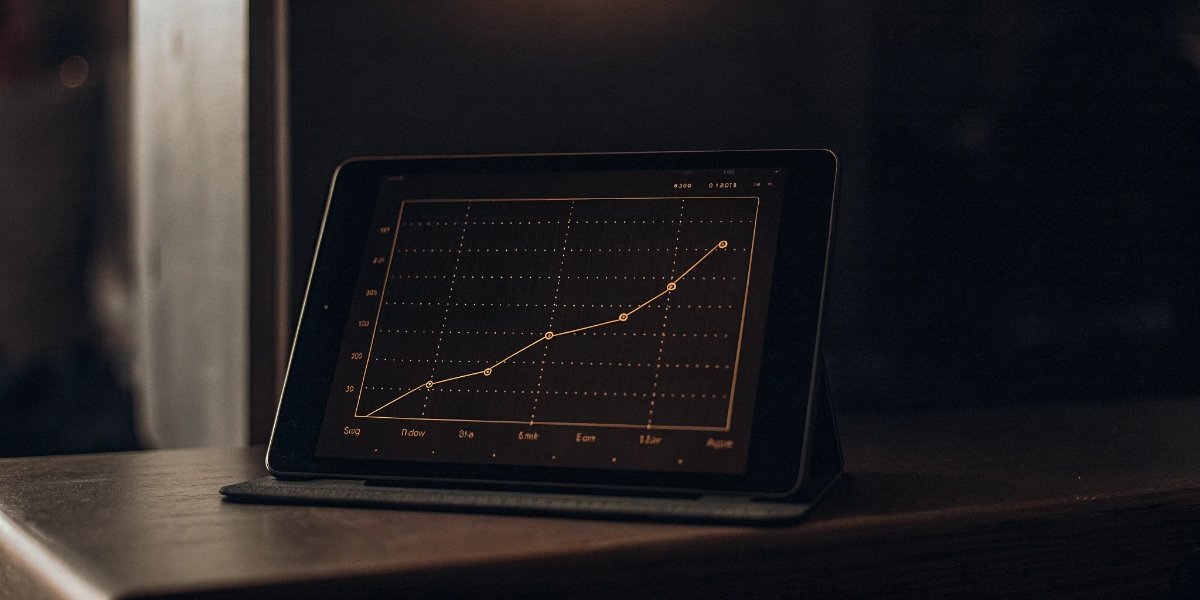 Analyzing sheep weight data A graph showing sheep weight gain over time on a tablet.