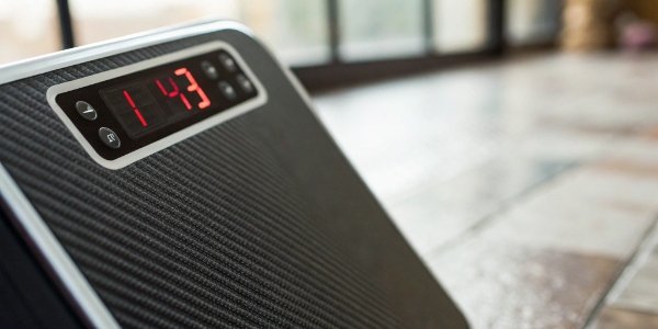 A close-up of a scale's digital display with numbers erratically jumping.