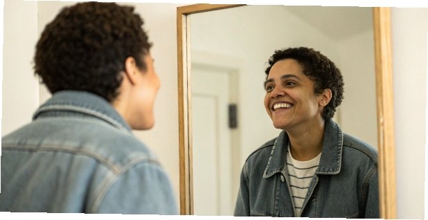 Health is More Than a Number on a Scale A person looking happily at their reflection, not a scale