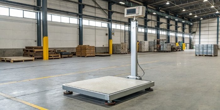 An industrial weighing scale in a warehouse environment
