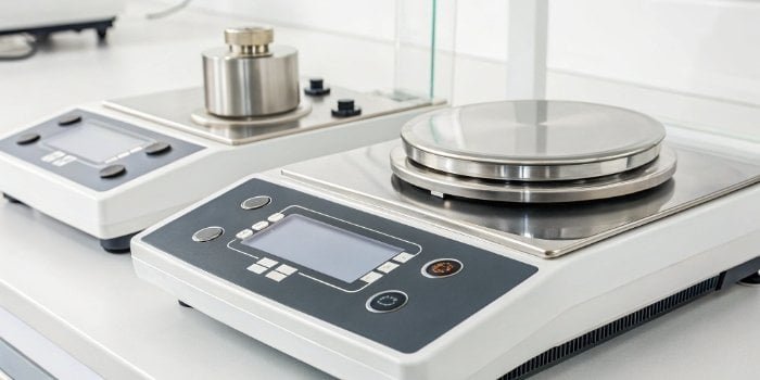 Ultra Precision Scale Technology A close-up shot of a high-precision laboratory scale's digital display and weighing pan