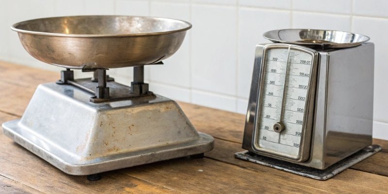 A cheap plastic scale next to a robust industrial stainless steel scale