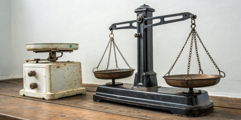 An outdated industrial scale next to a modern weighing system