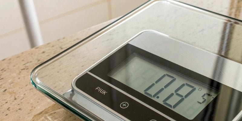 A digital display showing a precise weight reading from a single-draft scale