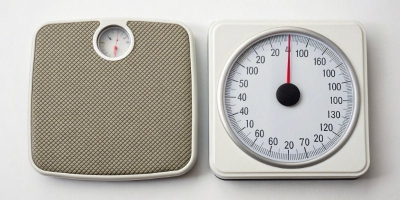 a side-by-side comparison of a digital scale display and an analog scale dial