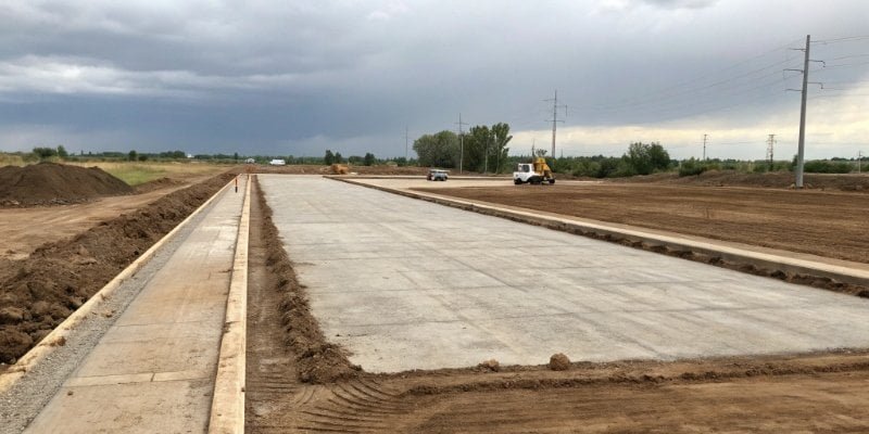 Ideal Site for Truck Scale Installation A wide-angle shot of a prepared and leveled site ready for a truck scale installation.