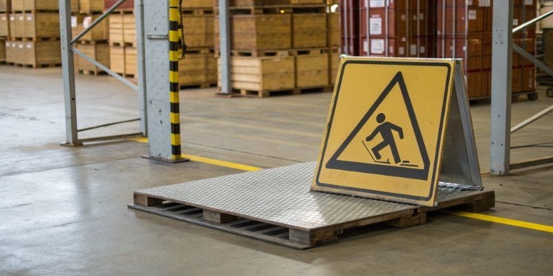 Industrial Scale Safety A safety sign showing "Do Not Drop" above a floor scale in a warehouse.