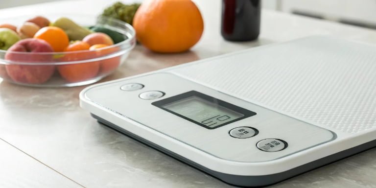 How often does my electronic scale need to be calibrated to ensure accuracy?