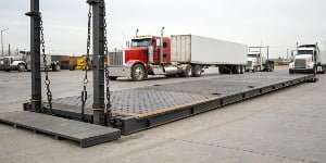 What are the factors that influence the price of a truck scale?