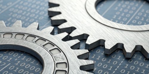 An illustration showing gears labeled "Hardware" and "Software" perfectly meshing together.