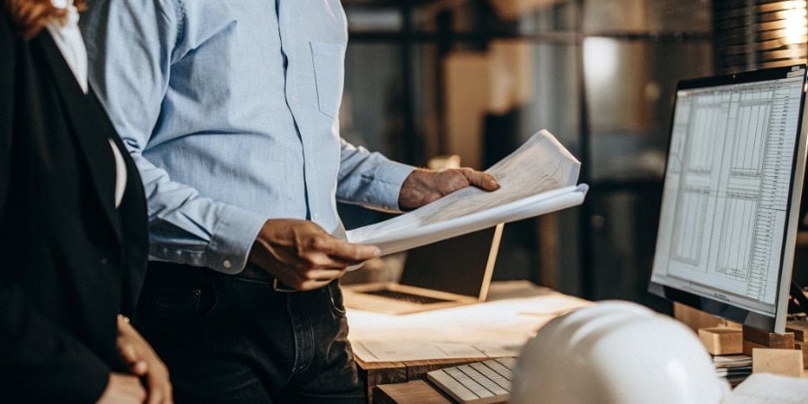 Key Considerations for Buying a Business Scale A purchasing manager reviewing specifications for an industrial scale