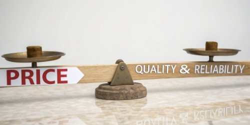 A seesaw with "Price" on one end and "Quality & Reliability" on the other