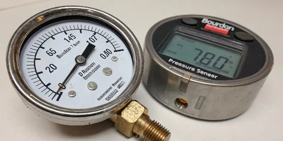 Limitations of a Pressure Gauge A Bourdon tube pressure gauge next to a modern digital pressure sensor