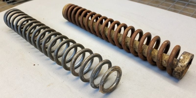 Analog Scale Inaccuracy An image showing a worn-out, stretched metal spring next to a new one.