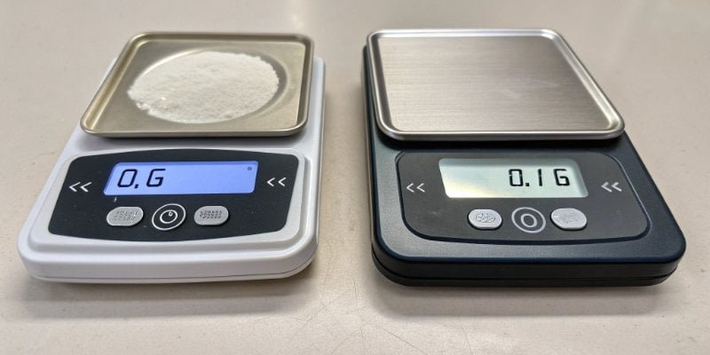 Scale Readability Comparison Side-by-side comparison of two scales, one showing 0 g, one showing 0.1 g
