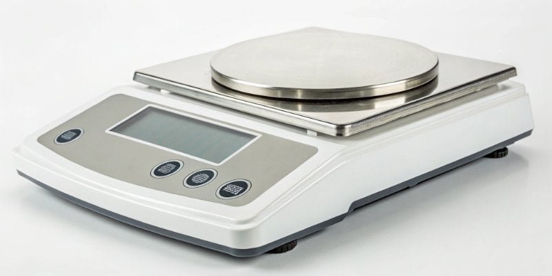 A 0.1g Precision Digital Scale A high-precision 0.1g laboratory scale with a draft shield