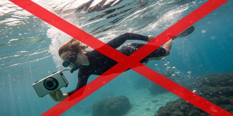 A red X over a person swimming with an IP67 device