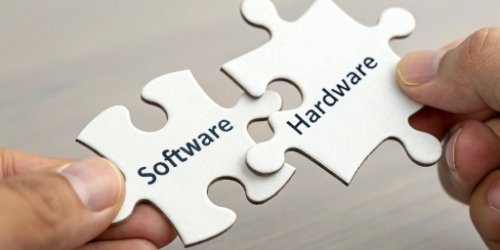 Two puzzle pieces, one labeled "Software" and the other "Hardware", fitting together perfectly