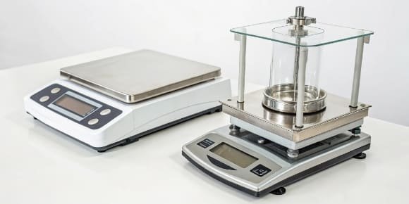 Weighing Instruments: Scale and Balance A side-by-side comparison of a lab balance and an industrial platform scale