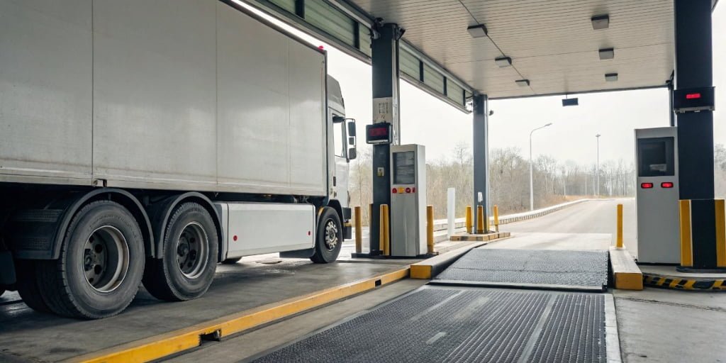 How do the scales at truck weigh stations work?