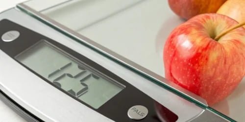 A close-up of a digital scale display showing the 'Count' and a number like '1,254 PCS'