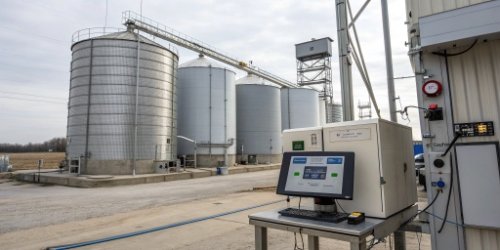 Connected Weighing for Inventory Management Silos and tanks with digital weight readouts connected to a central computer system.