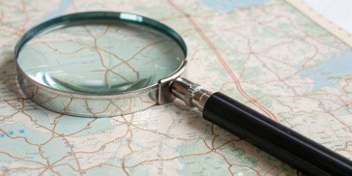 How to Find the Best Programmable Scale Supplier A magnifying glass over a map, indicating the search for a supplier