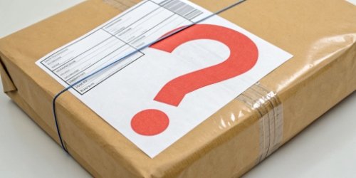 A shipping label on a package with a large red question mark over the weight information.