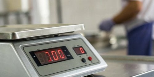 Enhanced Weighing Precision A close-up of a scale's digital display showing stable weight despite vibrations