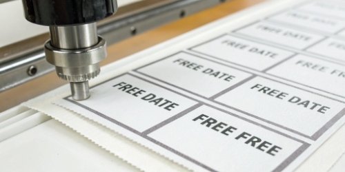 A close-up of a freshly printed label with a use-by date