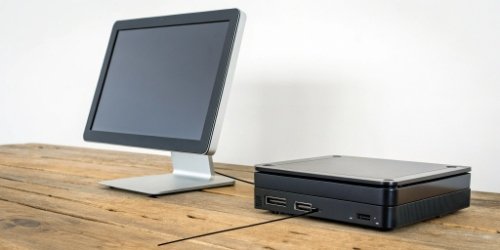 A simple diagram comparing a traditional PC-based setup to a sleek, all-in-one smart scale terminal setup