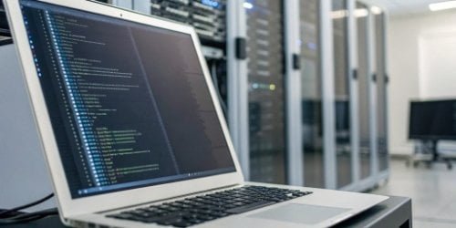 Enhanced Software Solutions Software code flowing seamlessly into a hardware device