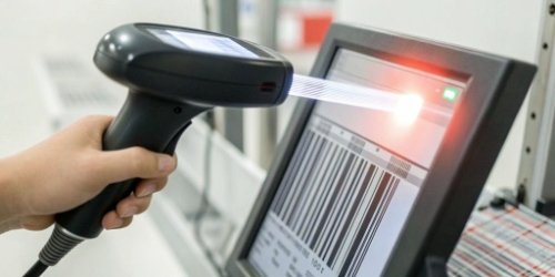 Automated Product Information Query A close-up shot of a barcode being scanned, with data flowing to a scale's screen.