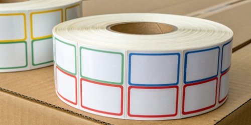 Custom Pre-Printed Labels A roll of custom labels featuring a company logo and colored borders