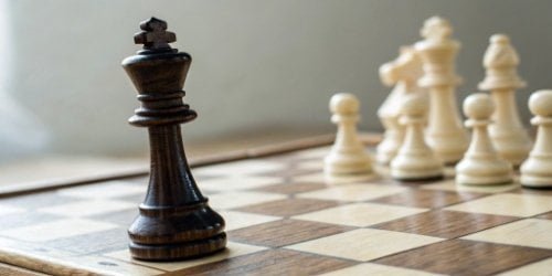 Market Strategy A chess piece moving strategically on a board