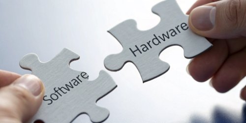 Two puzzle pieces, one labeled "Software" and the other "Hardware," fitting together perfectly.
