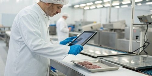 A quality control inspector using a smart PC scale with a touch screen to record data